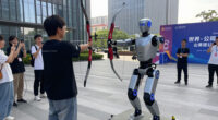 Robot Archer Lights Up 'Zhixin' As 2Nd World Humanoid Robot Games Open In Beijing
